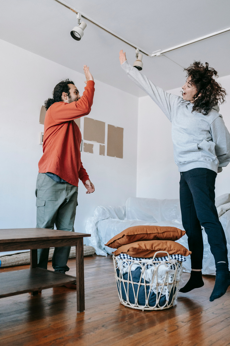 Couple Having Fun Time While Moving Out